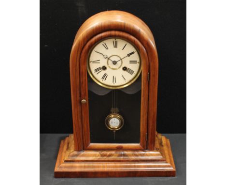 A mahogany domed case eight day mantel clock, glazed door, enamel dial with Roman numerals, twin winding holes, stepped base,