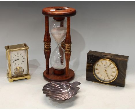 A Christofle silver plated scallop shaped dish, 15cm; a treen mounted hourglass, 28cm; a mantel clock, presented by Rolls Roy