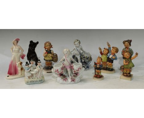 A pair of Sitzendorf figural table salts, putto; a Russian model bear; Goebel Hummel figures; an Art Deco figure (10) 