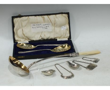 A 19th century ladle, the long haft applied with foliage, 38cm long;  a pair of E.P.N.S. berry spoons, cased;  Sheffield Plat