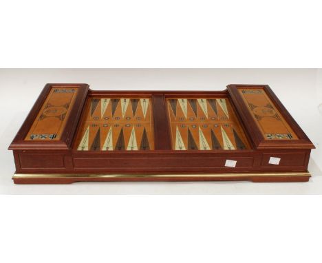 A Franklin Mint Excalibur backgammon set, with pamplets, missing two pieces 