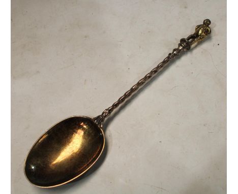 A mid-Victorian parcel-gilt silver 'Apostle' table spoon, the figural finial cast as a rotund gentleman, 21.5cm long, London 