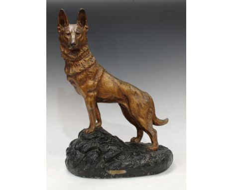 An Art Deco plaster model of an Alsatian dog, standing on an outcrop, Alerte, by Petrilly, 53cm high 