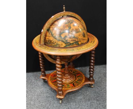 A mid-20th century novelty floor-standing drinks cabinet, as a globe, spirally turned supports, 100cm high 