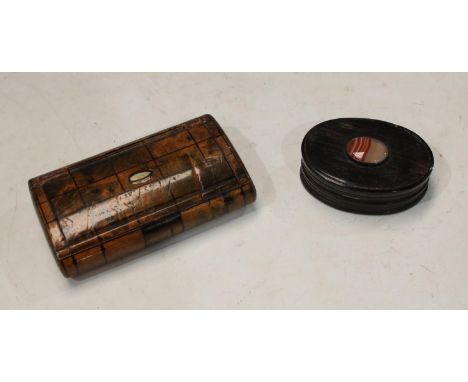 A 19th century walnut cushion shaped snuff box, c.1870; another, horn with banded agate boss (2) 