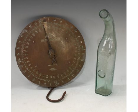 A Salter brass Milk Balance scale, No57, 26cm diameter; a green tinged glass grape storing bottle, Copped Hall, patent applie