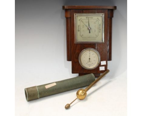 A brass hydrometer, cardboard cylinder; an oak cased aneriod wall barometer (2) 