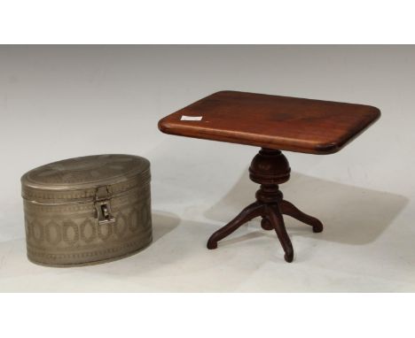 A miniature apprentice type mahogany tilt top table, turned support, tripod base, 15cm high; an oval paktong tea caddy, chase