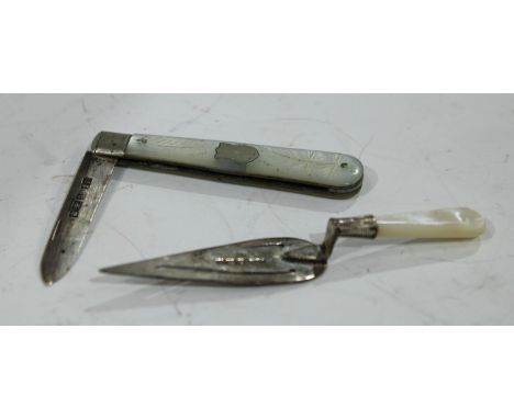 A mother of pearl and silver bookmark, as a trowel; a similar aide memoire 