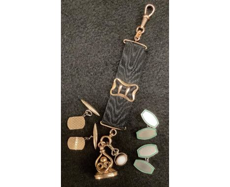 A gilt metal seal fob plain crystophrase matrix, unmarked ornate wirework body, another smaller revolving, both suspended fro