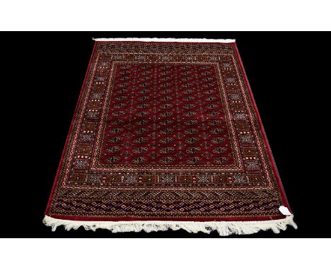 A Large Silk Rug Bokhara Rug on red ground with repeated lozenge design. Dimensions, 1.90 x 1.40 M Brand new condition