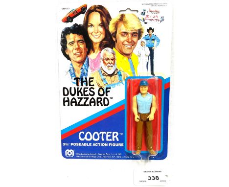 Mego vintage The Dukes of Hazzard Cooter 3 3/4" figure MOC, Near Mint, within Good (dented and yellowed) bubble, upon Excelle