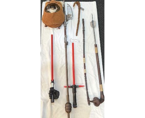 A selection of Star Wars 1:1 scale Prop Replica items including Sand People Gaffi stick, Skiff Vibro Axe, Rey Staff, and Yoda