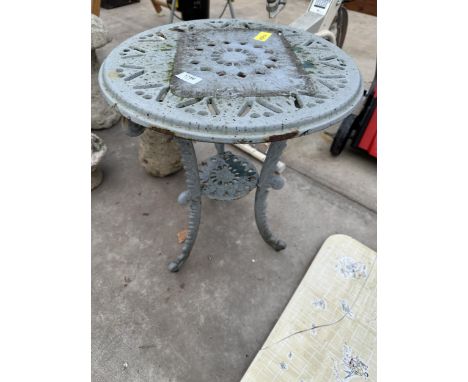 A SMALL CAST IRON BISTRO TABLE 