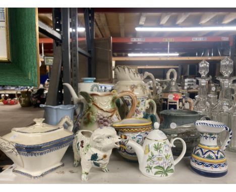 A COLLECTION OF VARIOUS CERAMIC JUGS AND TEAPOTS ETC 
