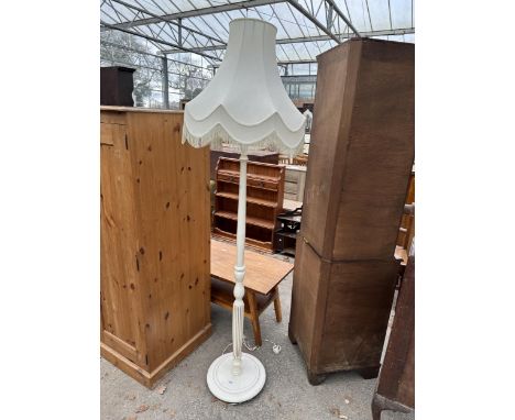 A PAINTED STANDARD LAMP WITH SHADE 