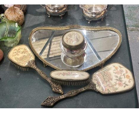 A VINTAGE DRESSING TABLE SET TO INCLUDE A MORRORED TRAY, POT POURRI POT, BRUSH AND MIRROR SET WITH PETIT-POINT DECORATION 