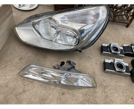 A FORD HEADLIGHT AND SIDE LIGHT 