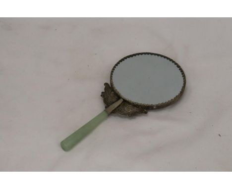 A JADE AND WHITE METAL BIRD MIRROR 