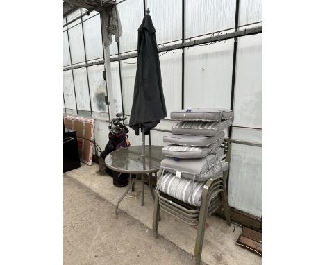 A GLASS TOPPED PATIO TABLE WITH FOUR STACKING CHAIRS, CUSHIONS AND PARASOL 