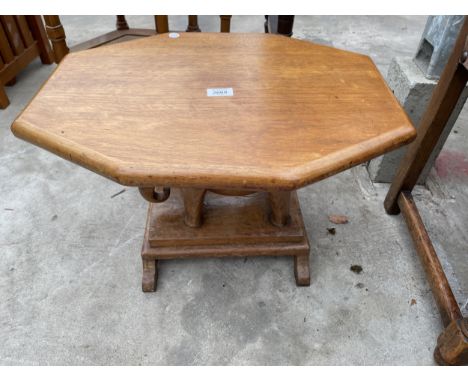 A RETRO TEAK OCCASIONAL TABLE ON AN ELEPHANT BASE 