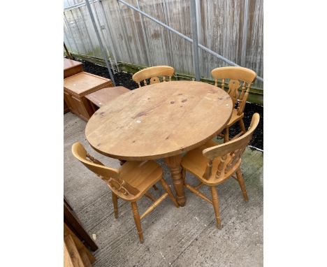 A PINE DINING TABLE ON TURNED LEGS 48" DIAMETER WITH FOUR VICTORIAN STYLE KITCHEN CHAIRS 