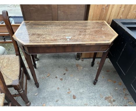 A 19TH CENTURY MAHOGANY AND CROSSBANDED SIDE TABLE ON TAPERING LEGS WITH SPADE FEET 36" WIDE 