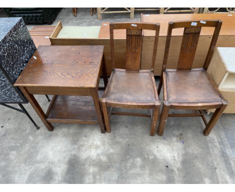 A PAIR OF MID 20TH CENTURY OAK DINING CHAIRS AND A TWO TIER OAK TABLE 