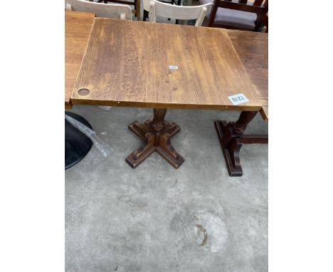 AN OAK PUB TABLE ON PEDESTAL BASE 29" X 36" 
