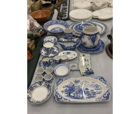 A LARGE COLLECTION OF BLUE AND WHITE PLATES, JUGS, BOWLS, CUPS, SAUCERS, NAPKIN RINGS, ETC TO INCLUDE DELFT TILES, COPELAND S