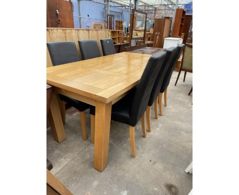 A MODERN OAK EXTENDING DINING TABLE 71 X 35.5 INCH (TWO LEAVES 12 INCH EACH) WITH SIX FAUX BLACK LEATHER DINING CHAIRS 