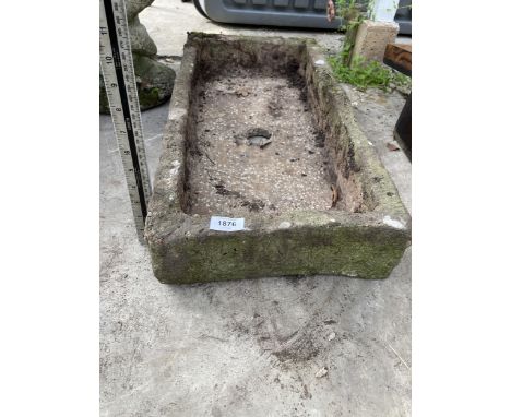 A LOW CONCRETE GARDEN TROUGH PLANTER 