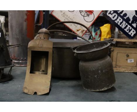 TWO LARGE HEAVY CAST PANS, A VINTAGE BRASS LAMP - A/F AND A SMALL CHURN 