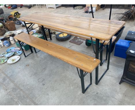 A FOLDING WOODEN TABLE AND TWO BENCHES 