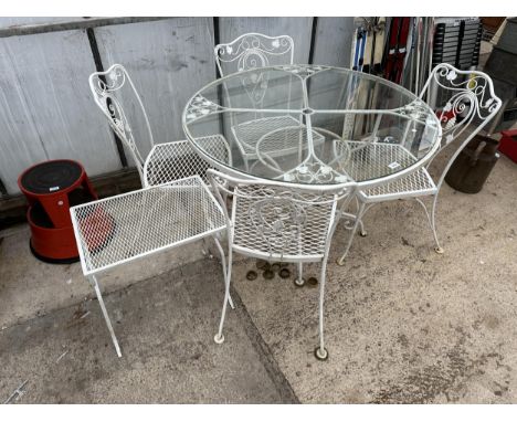 A METAL AND GLASS TOPPED PATIO TABLE WITH FOUR CHAIRS AND A SIDE TABLE 