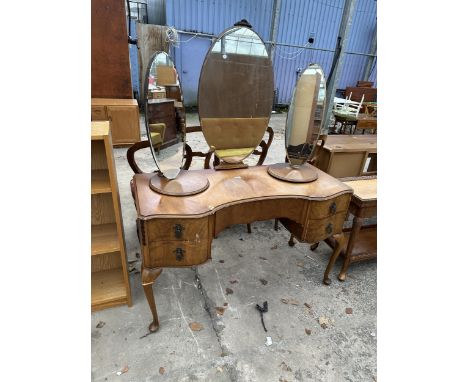 A MID 20TH CENTURY WALNUT DRESSING TABLE ON CABRIOLE LEGS WITH TRIPLE MIRROR TWO BEING SWIVEL 48" WIDE 