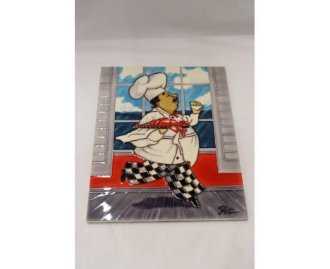 A LARGE TILE WITH A CHEF DESIGN, 28CM X 36CM 