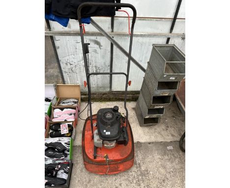 A FLYMO LAWN MOWER WITH HONDA ENGINE 