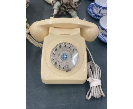 A VINTAGE CREAM ROTARY DIAL TELEPHONE 