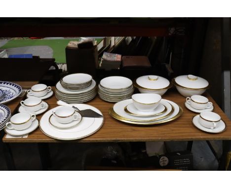 A WHITE WITH GILT EDGES GERMAN PART DINNER SERVICE TO INCLUDE, LIDDED SERVING DISHES, SERVING PLATES, PLATES, BOWLS, CUPS, SA