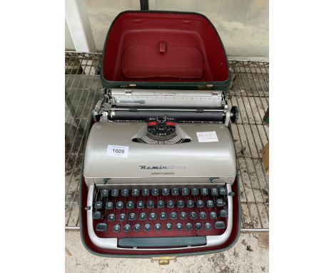 A REMINGTON QUIET-RITER TYPEWRITER WITH CARRY CASE 