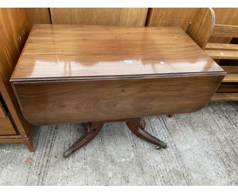 A 19TH CENTURY MAHOGANY DROP-LEAF PEDESTAL TABLE WITH SINGLE DRAWER ON BRASS CASTORS 