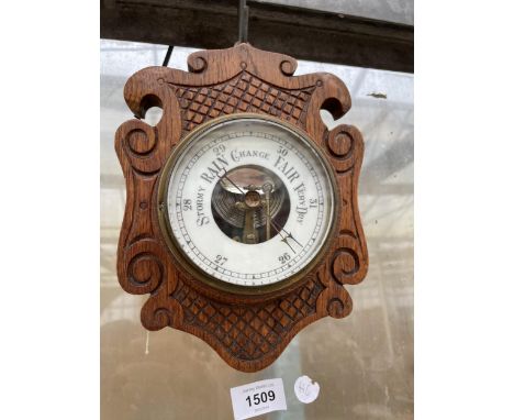 A SMALL OAK CASED WALL BAROMETER 