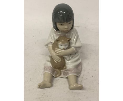 A NAO FIGURE OF OF A GIRL CUDDLING HER PUSSY 