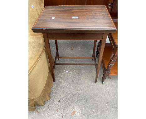 AN EDWARDIAN MAHOGANY AND IN LAID FOLD OVER GAMES TABLE 