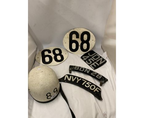 A 1960 MOTOR BIKE RACE HELMET TOGETHER WITH RACE NUMNER PLATES AND MOTOR BIKE NUMBER PLATES 
