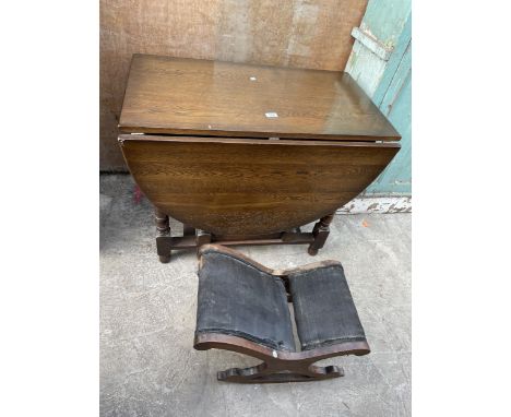 A MID 20TH CENTURY OAK GATE-LEG DINING TABLE AND GOUT STOOL 