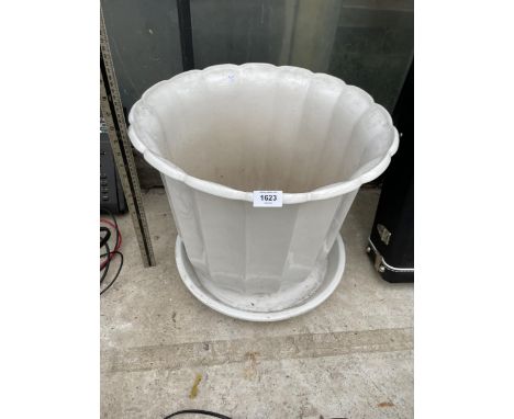 A LARGE WHITE CERAMIC PLANTER 