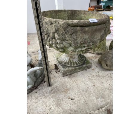 A CONCRETE GARDEN URN PLANTER 