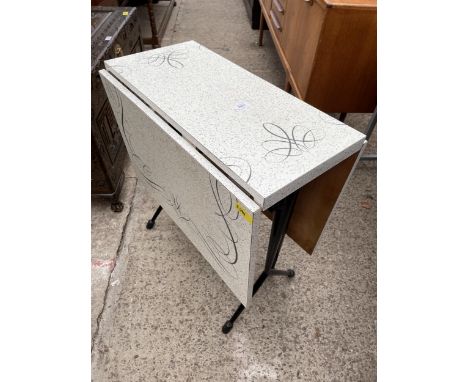 A 1950'S FORMICA TOP GATE LEG TABLE ON TUBULAR BLACK METAL KICK OUT LEGS 47" X 26.5" OPENED 